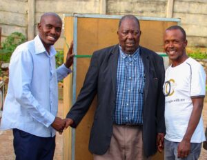 Dr C.T Mugweni handing over an incubator donated by PACT Missionaries to Bear Valley Bible Institute-Mozambique